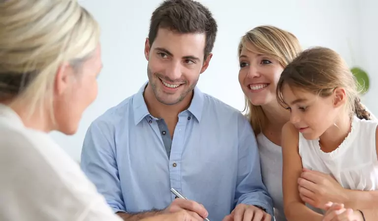 family discussing something with a property manager