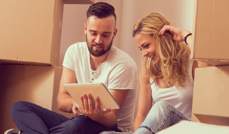 couple watching something on a tablet