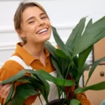 woman with a plant during a household move
